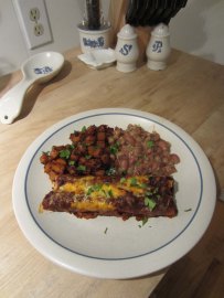 Chicken enchiladas in red sauce, potatoes roasted in red chile, and Anasazi beans in chipotle. The blank space on the plate is for the side salad that I did not make.