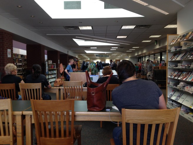 The Erna Fergusson Library has rows of tables with power strips for the techno-fortunate who fetch their own machinery hither and thither.