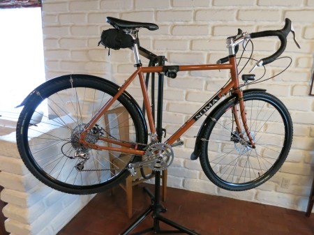 The latest iteration of the Soma Saga touring bike, this one with disc brakes and a dynamo headlight.