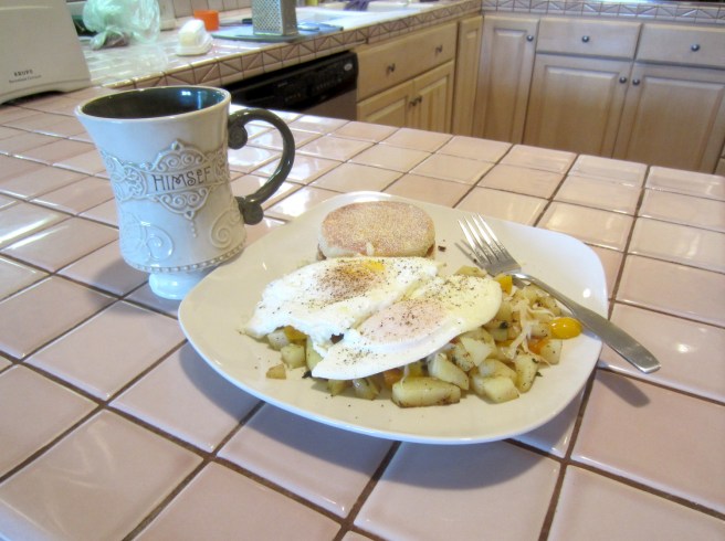 The fabled Three Pepper Hash, topped with two eggs over easy and a side of Lucky Irish Breakfast tea with lemon and honey.