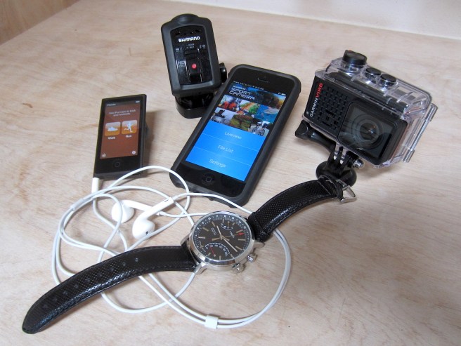 Clockwise from left: The iPod Nano with its fitness app; the Shimano Sports Cam; my iPhone with the cam app open; Garmin's VIRB Ultra 30; and the Timex Metopolitan+ watch and fitness tracker.