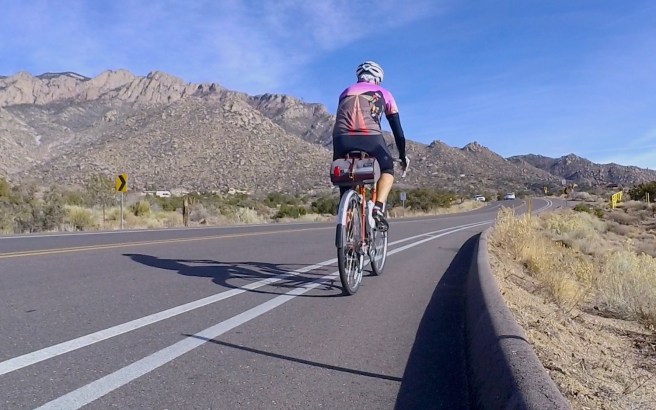 Climbing toward the Sandia tram on behalf of Adventure Cyclist magazine.